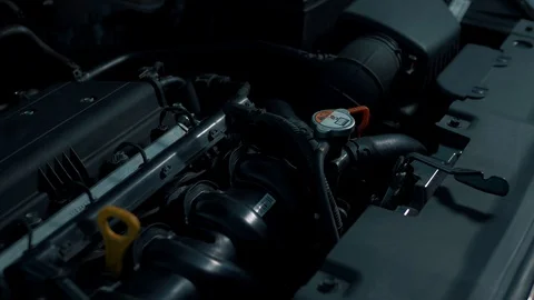 Car engine under the hood at the service station, dark background Stock Footage 102665203