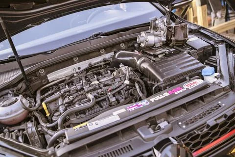 Car engine undergoing maintenance and repairing process Foto stock