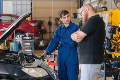 Car engineer technician worker, Technician team use laptop computer for tun.. Stock Photos