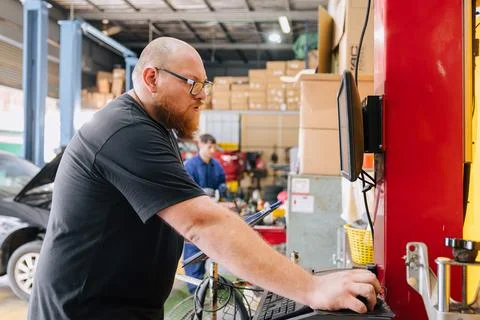 Car engineer technician worker, Technician team use laptop computer for tun.. Stock Photos