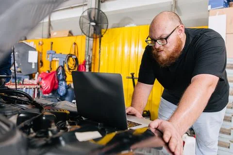 Car engineer technician worker, Technician team use laptop computer for tun.. Stock Photos