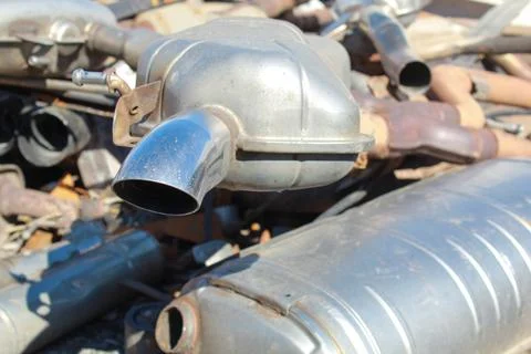 Car exhaust elements, environmental pollution, industrial waste. Stock Photos