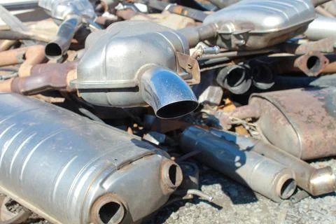 Car exhaust elements, environmental pollution, industrial waste. Stock Photos