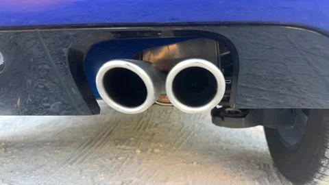 Car exhaust with the engine running Stock Footage 327364202