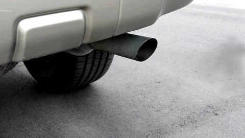 Car exhaust Smoke coming out of the pipe... | Stock Video | Pond5