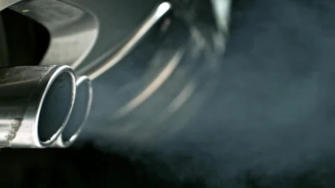 Car exhaust Smoke coming out of the pipe... | Stock Video | Pond5