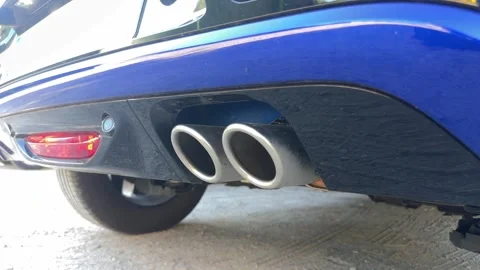 Car exhaust vibrating while engine revving Stock Footage 327113753