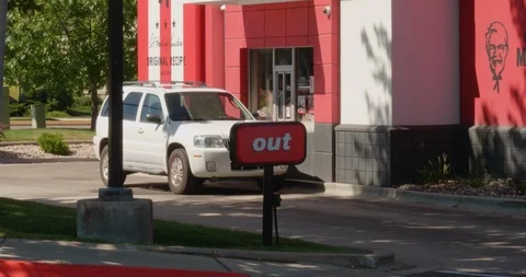 Car Exiting the Drive Thru at a KFC (Kentucky Fried Chicken) Stock Footage 92110585