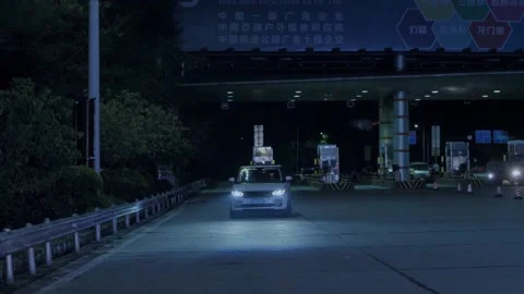 Car exits toll booth Stock Footage 235276476