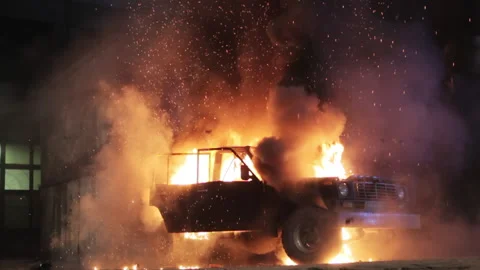 The car explodes and the hood and roof are torn off. A black SUV is torn apart Video stock 159701820