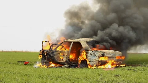 A Car Explodes A Wheel. Explosion Wheel. Wheel Explosion In Burning Car. Stock Footage 98648399
