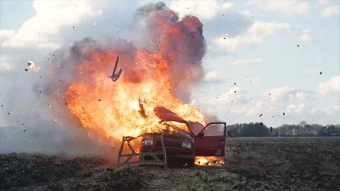 Car Explosion. Car blasts into the field. Slow Motion. Video stock 98643347