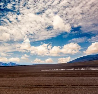 Car far away in desert Stock Photos