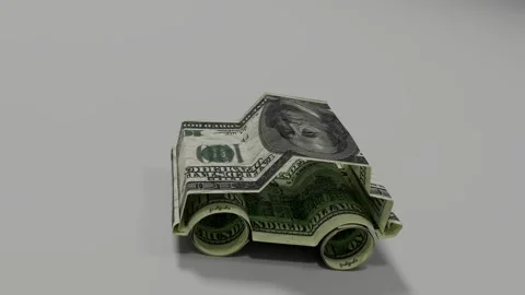 Car figure made of US banknotes illustrating ownership costs and expenses Stock Footage 314486359