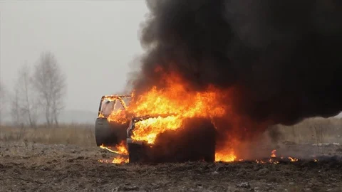Car On Fire, Burning Car In The Field, Front View Stock Footage 101531739