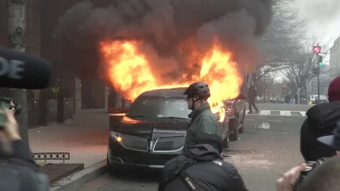 Car Fire during Inaugural Protests Stock Footage 71801772
