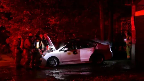 Car fire at night Stock Footage 99874916