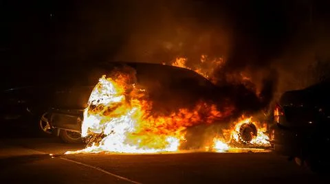 Car in flames at night Stock Photos