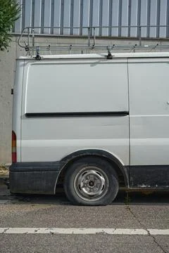 A car with a flat tire. Stock Photos