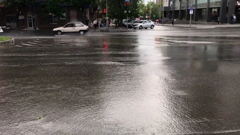The car flies into a huge puddle of water at high speed, splashes fly for Stock Footage 131542003