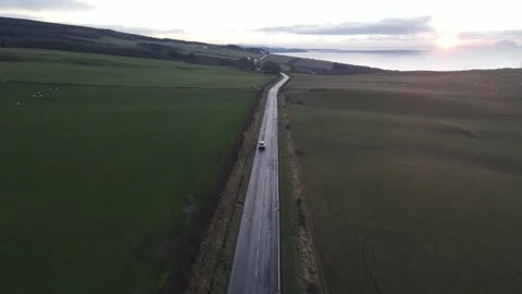 Car flyby FPV road dusk Stock Footage 336998020