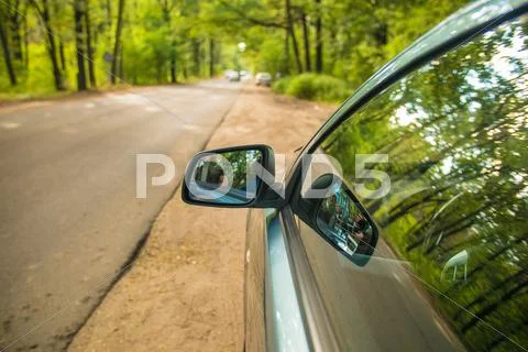 The car in the forest. Camera is outside the car Stock Photos