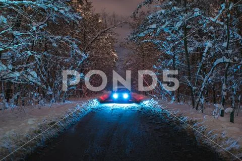 The car on the foster road with a snow. evening night time Stock Photos