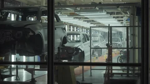 The car frame moves along the conveyor belt. Stock Footage 189514497