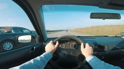 Car on freeway gets overtaken by another vehicle seen from POV Stock Footage 98663912
