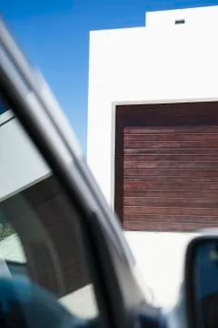 Car in front of a garage Stock Photos