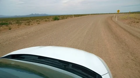 Car Front Point of View Driving Curvy Desert Road Stock Footage 76003805