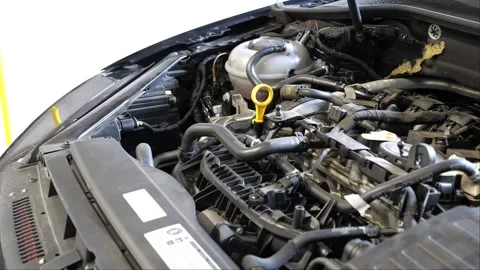 Car in the garage showing its engine and components while the camera is panning 스톡 동영상 268355893