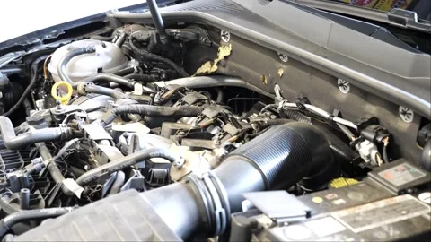 Car in the garage showing its engine and components while the camera is panning 스톡 동영상 268355939
