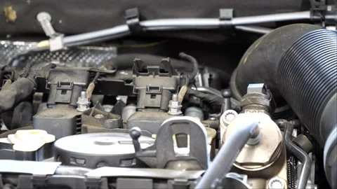 Car in the garage showing its engine and components while the camera is panning 스톡 동영상 268356019