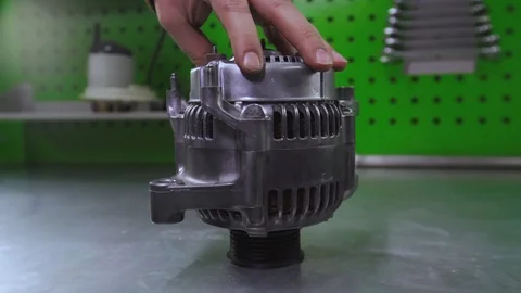 Car generator on the table Stock Footage 105753603