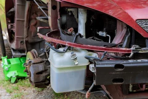 Car getting front passenger side fender replaced due to body damage Stock Photos