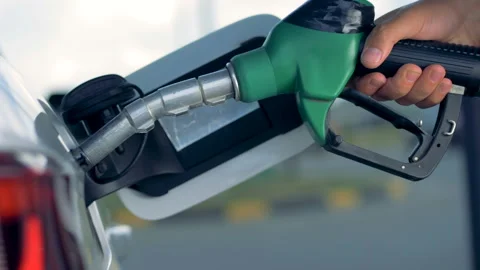 A car is getting refueled with the using of a fuel pistol Video stock 103223646