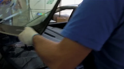 Car glass replacement at an auto repair shop Stock Footage