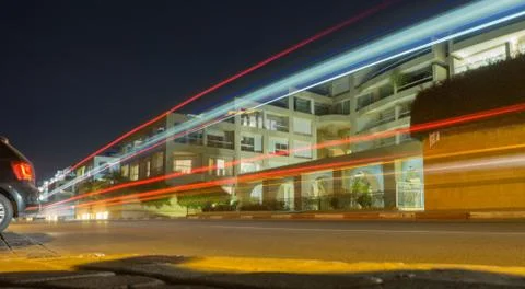 From the car go light strips on the background of buildings Stock Photos