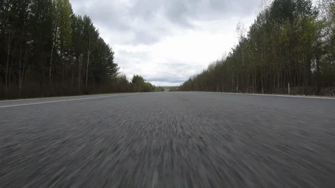 The car goes at high speed on the road.Dynamics. Stock Footage 110390490
