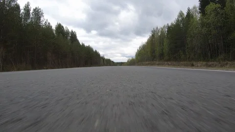 The car goes at high speed on the road.Dynamics. Stock Footage 110390528