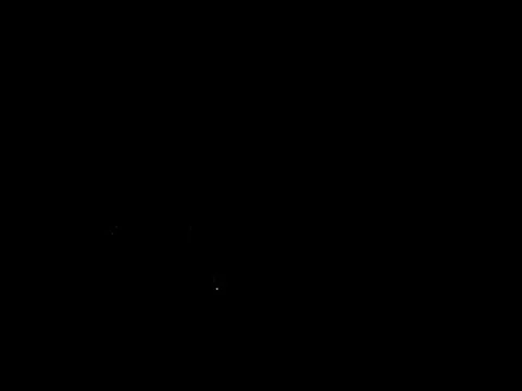 Car that goes by speed on a paved road all night illuminating the road with i Stock Footage 80262806