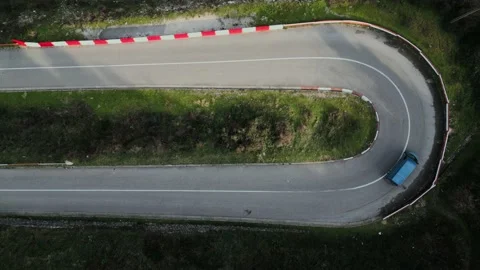 Car goes on switchback road, Stock Footage 229459281