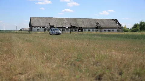 THE CAR GOES THROUGH THE FARM Stock Footage 158127050