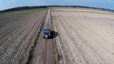 Car goes through the fields Stock Footage 75653927
