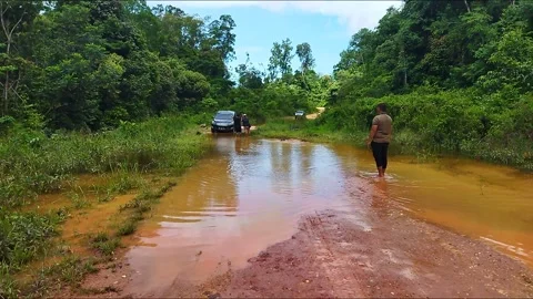 The car goes through the flood Stock Footage 211238714