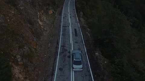 The car goes through the mountains Stockbeeldmateriaal 76353598