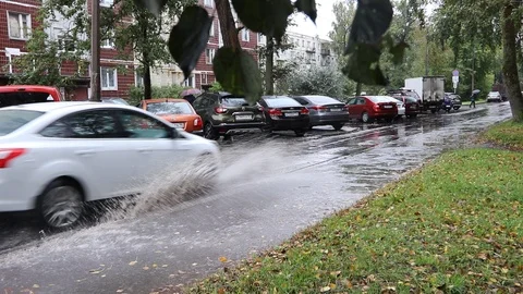 The car goes through a puddle. Stock Footage 116049973