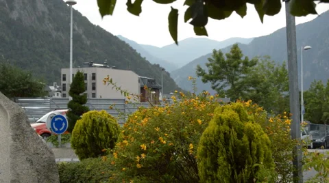Car Goes Through Roundabout While It Is Raining In The Mountains Stock Footage 67439669