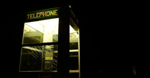 Car Going By Creepy Phone Booth Stock Footage